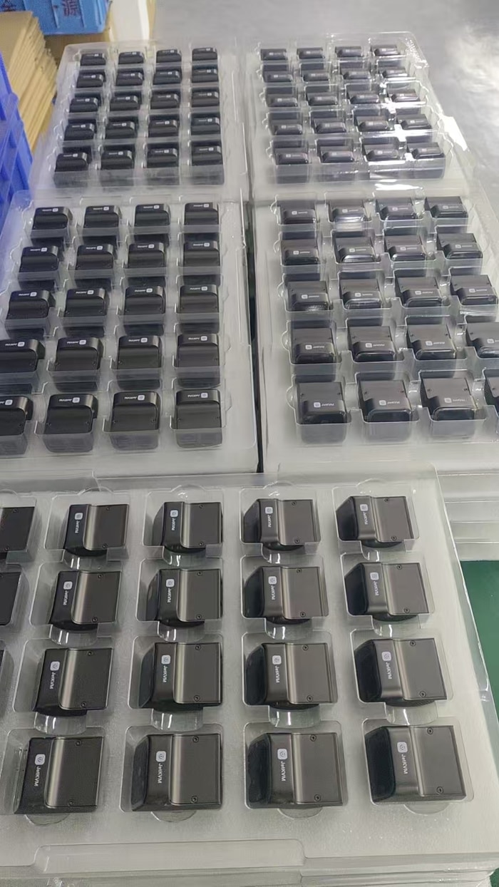 A pile of recently assembled JetKVM devices.