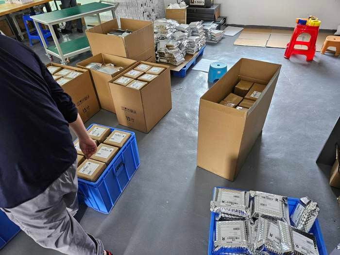 Packed and labeled JetKVM boxes ready to ship.